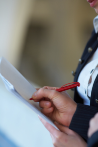 A businessperson writing